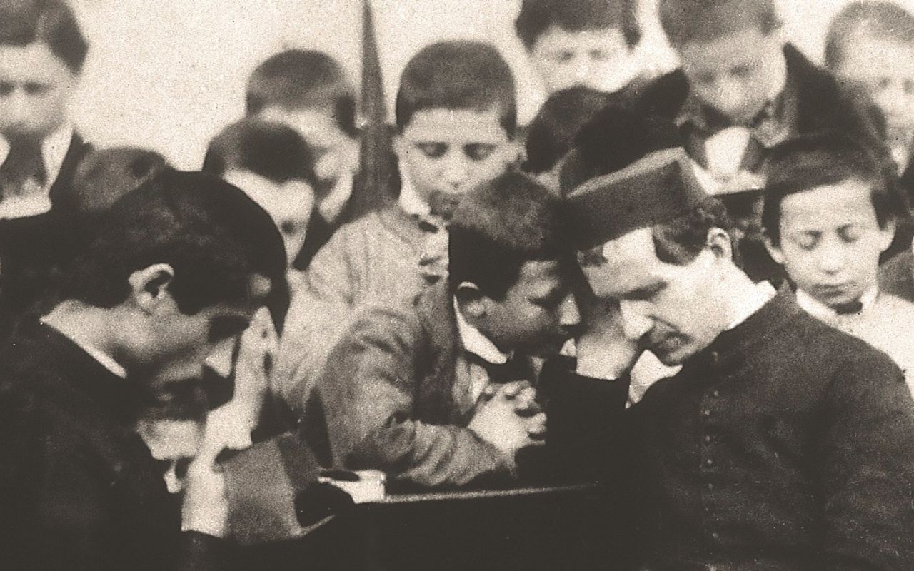 Il modello torinese di solidarietà - Don Bosco con i suoi ragazzi